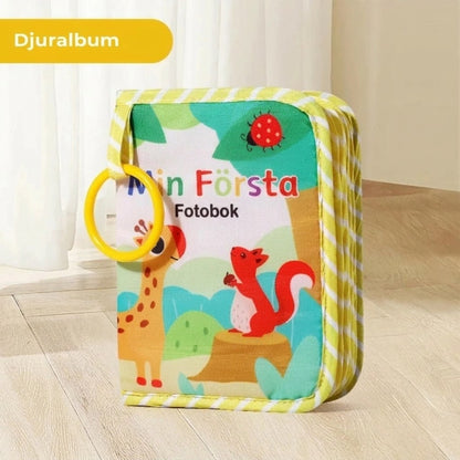 Mjuk babybok med spegel och bitring