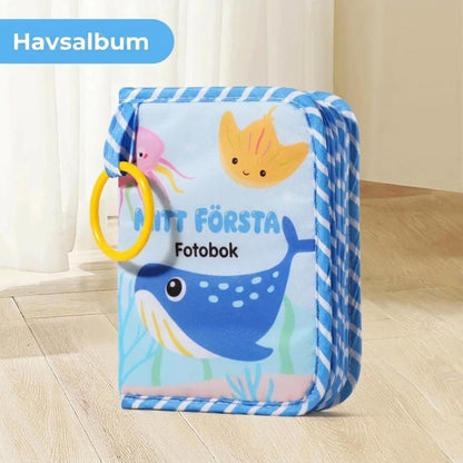Mjuk babybok med spegel och bitring